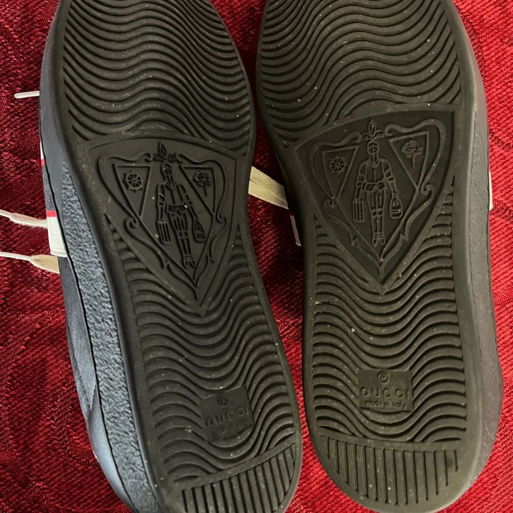 Gucci Black Leather Sneakers with Beige Logo Strap and Red Heel Accent